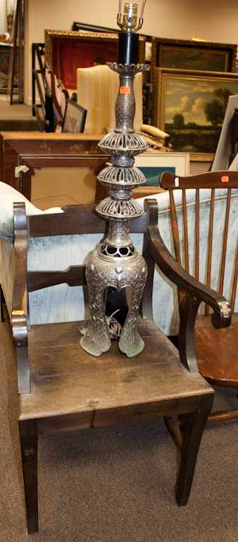 Appraisal: Continental oak armchair and an oriental silvered metal lamp Estimate