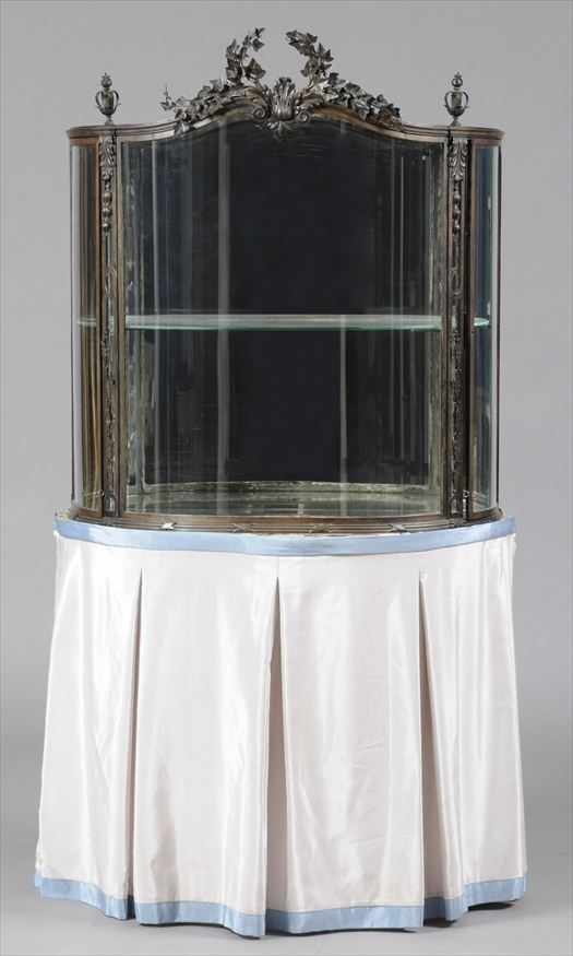 Appraisal: LOUIS XVI STYLE METAL BOWFRONT VITRINE CABINET ON SKIRTED STAND