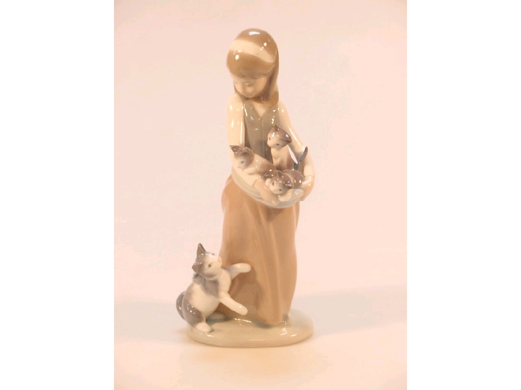 Appraisal: A Lladro figure of a young girl holding three kittens