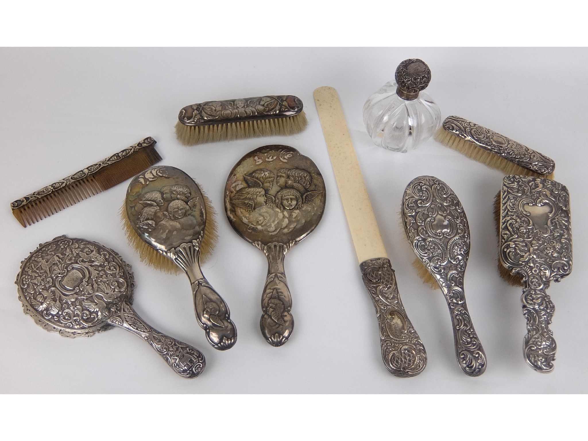 Appraisal: A silver handled ivory leaf turnerBirmingham def with various silver