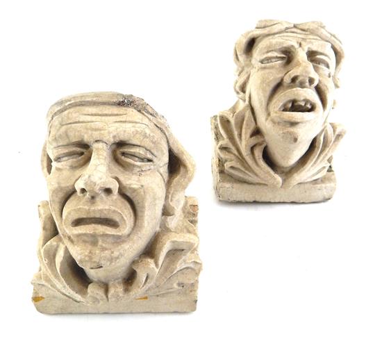 Appraisal: Two similar early architectural carved stone elements depicting contorted faces