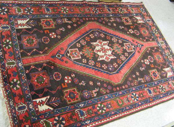 Appraisal: TWO PERSIAN AREA RUGS hand knotted in an overall geometric