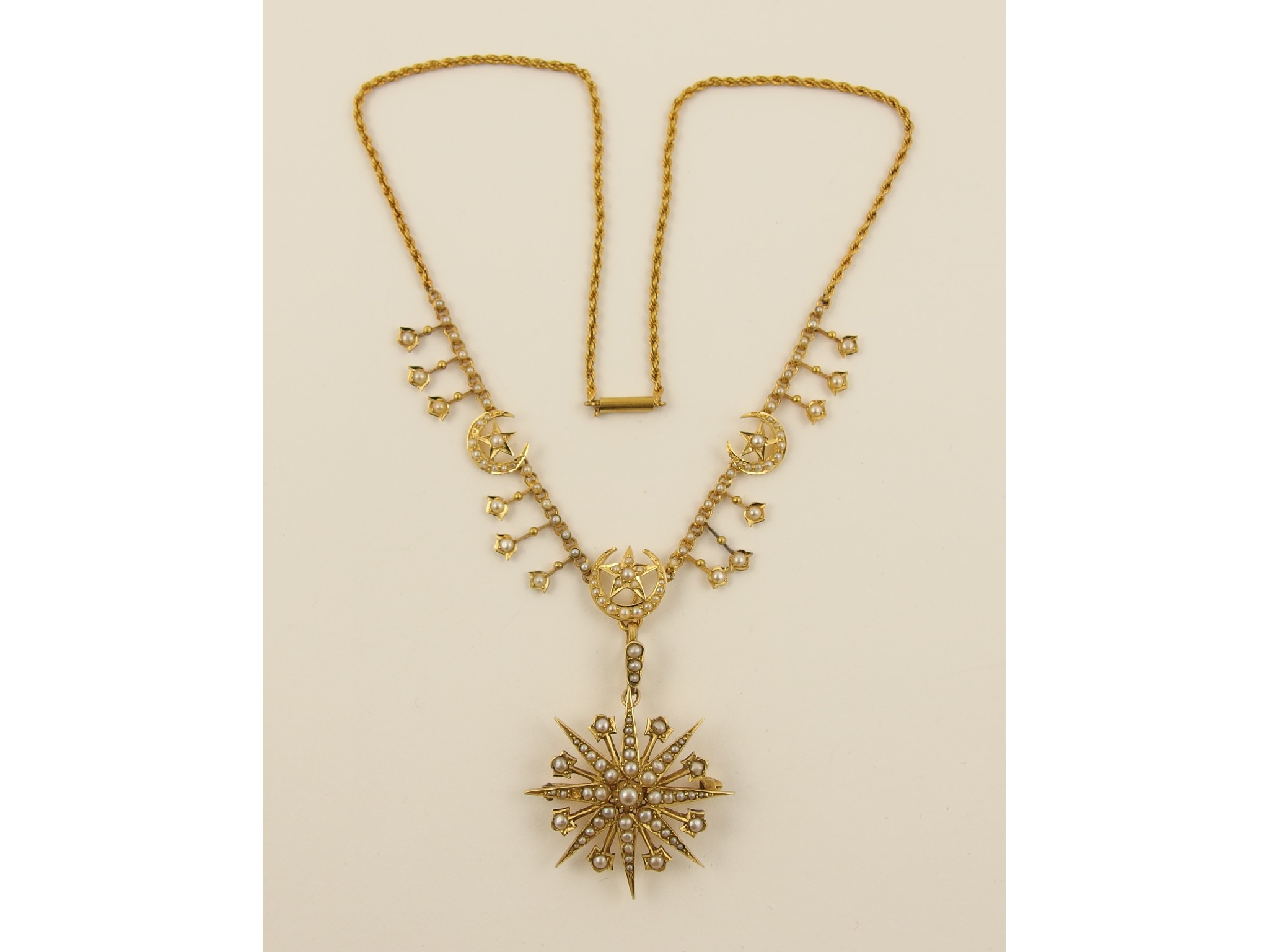 Appraisal: A Victorian pearl set star and moon necklacein ct yellow