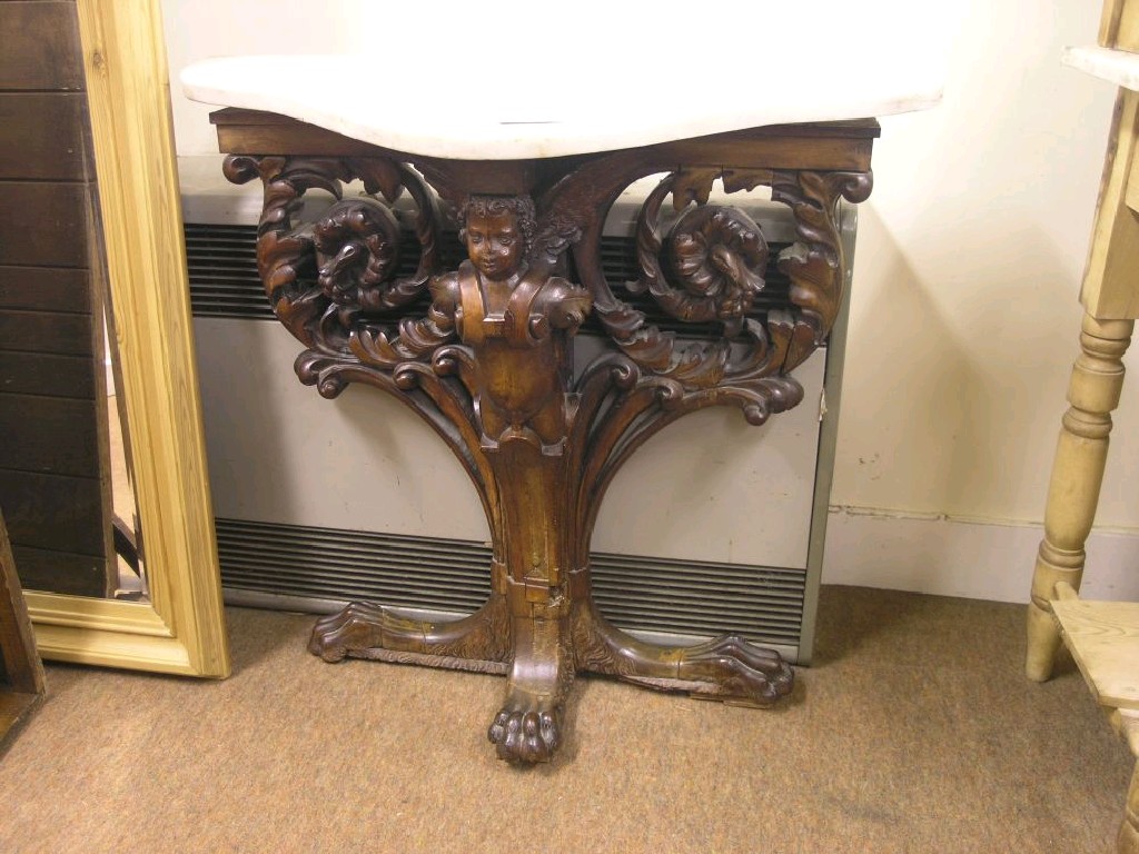 Appraisal: A th century Italian walnut console table boldly carved with