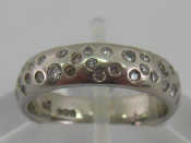 Appraisal: A platinum diamond set band ring size J gms