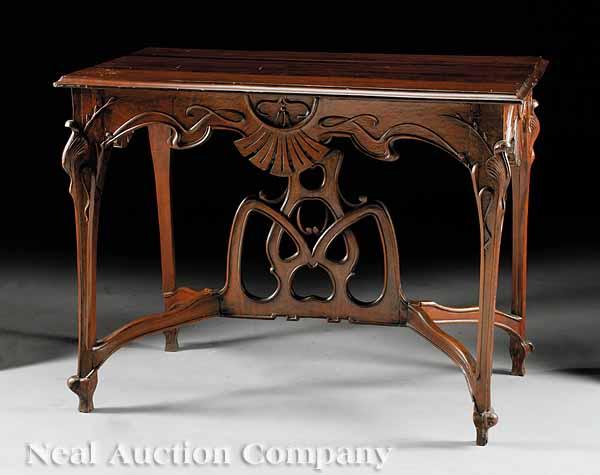 Appraisal: An Art Nouveau-Style Carved Mahogany Console Table molded top scalloped