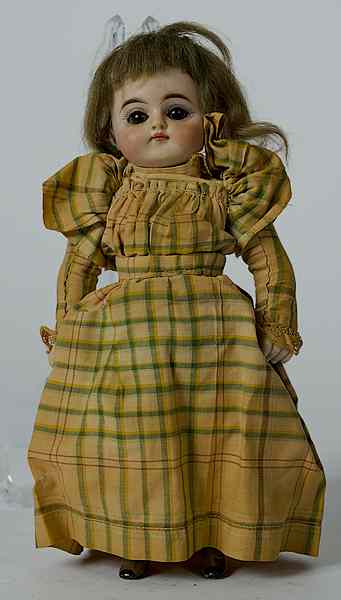 Appraisal: Bisque Head Doll Bisque head doll with brown sleepy eyes