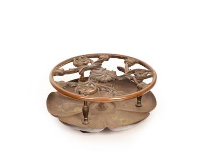 Appraisal: A Christopher Dresser trivet with pierced floral decoration cm diameter