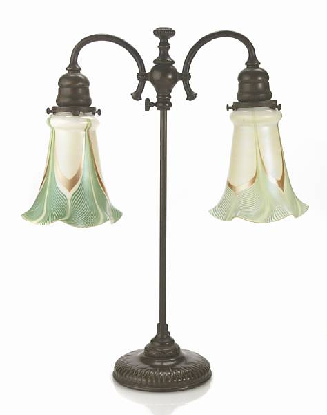 Appraisal: A Tiffany Studios bronze adjustable two-light student lamp with two