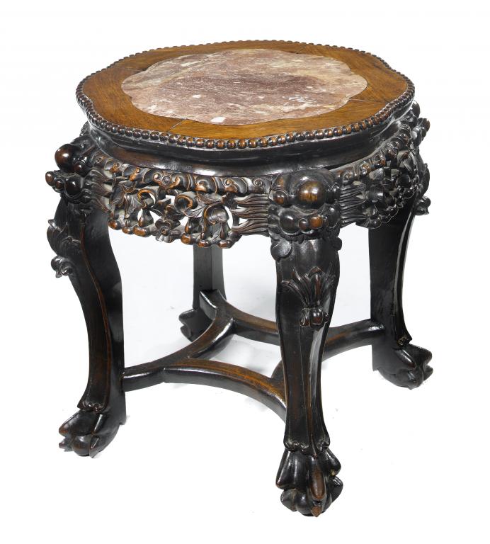 Appraisal: A CHINESE CARVED HARDWOOD URN-STAND with marble inset top and