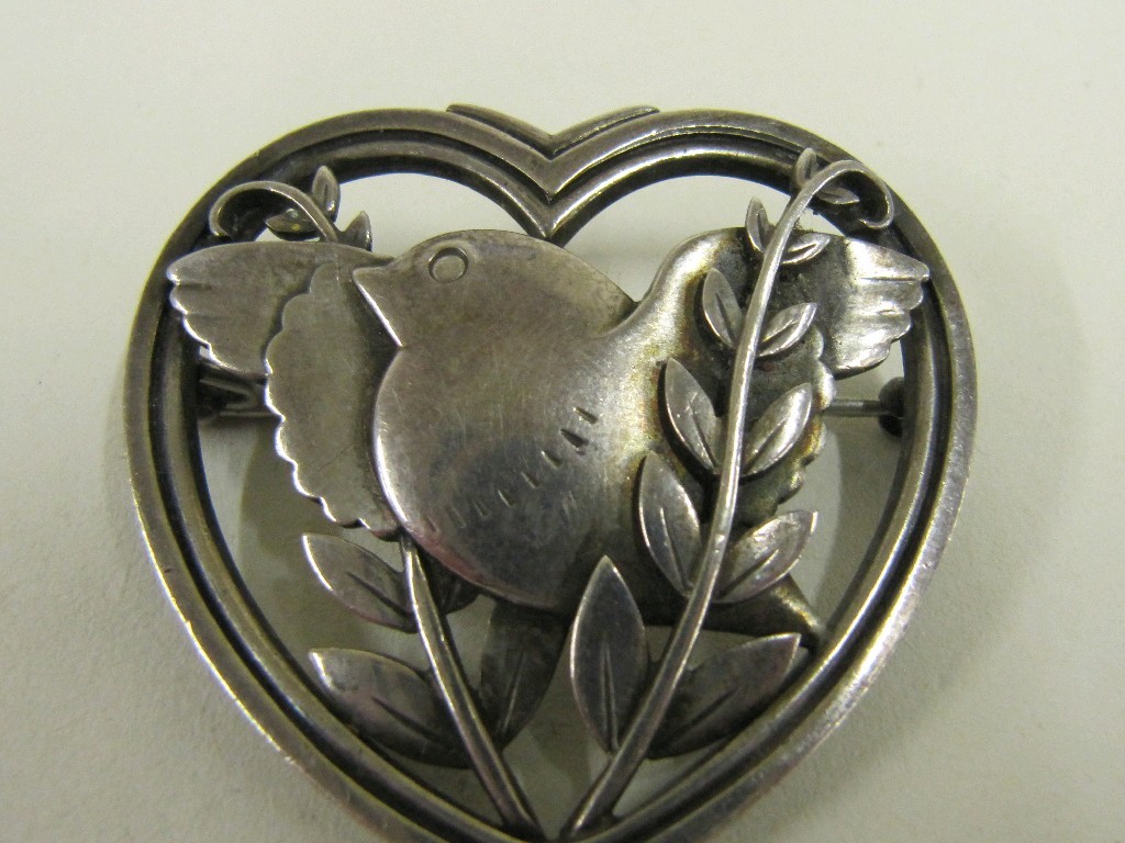 Appraisal: Georg Jensen silver brooch depicting a bird within a heart