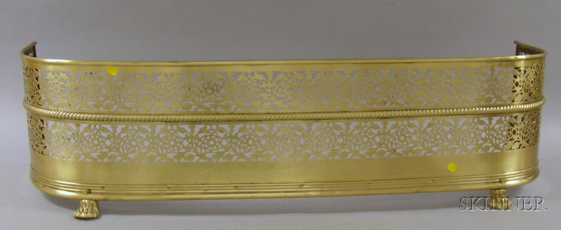 Appraisal: Pierced Brass Fireplace Fender with Paw Feet ht lg dp