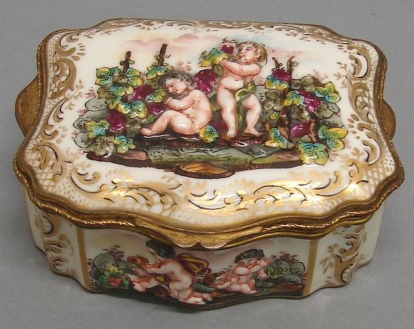 Appraisal: Two putti in vineyard sides with conforming putti decoration with