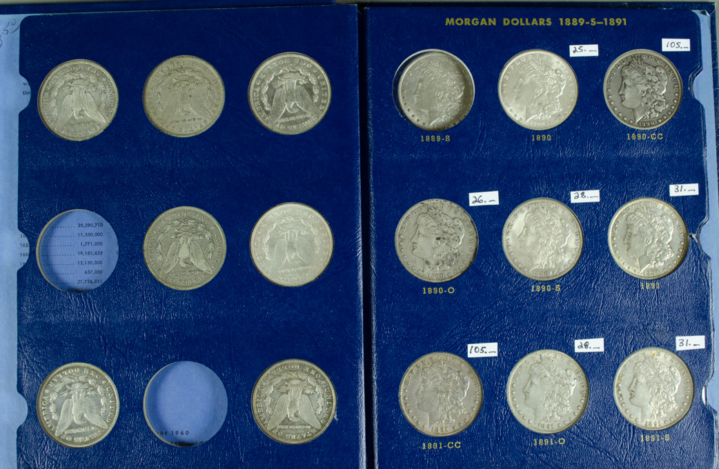 Appraisal: TWENTY-ONE U S SILVER MORGAN DOLLARS IN ALBUM - including