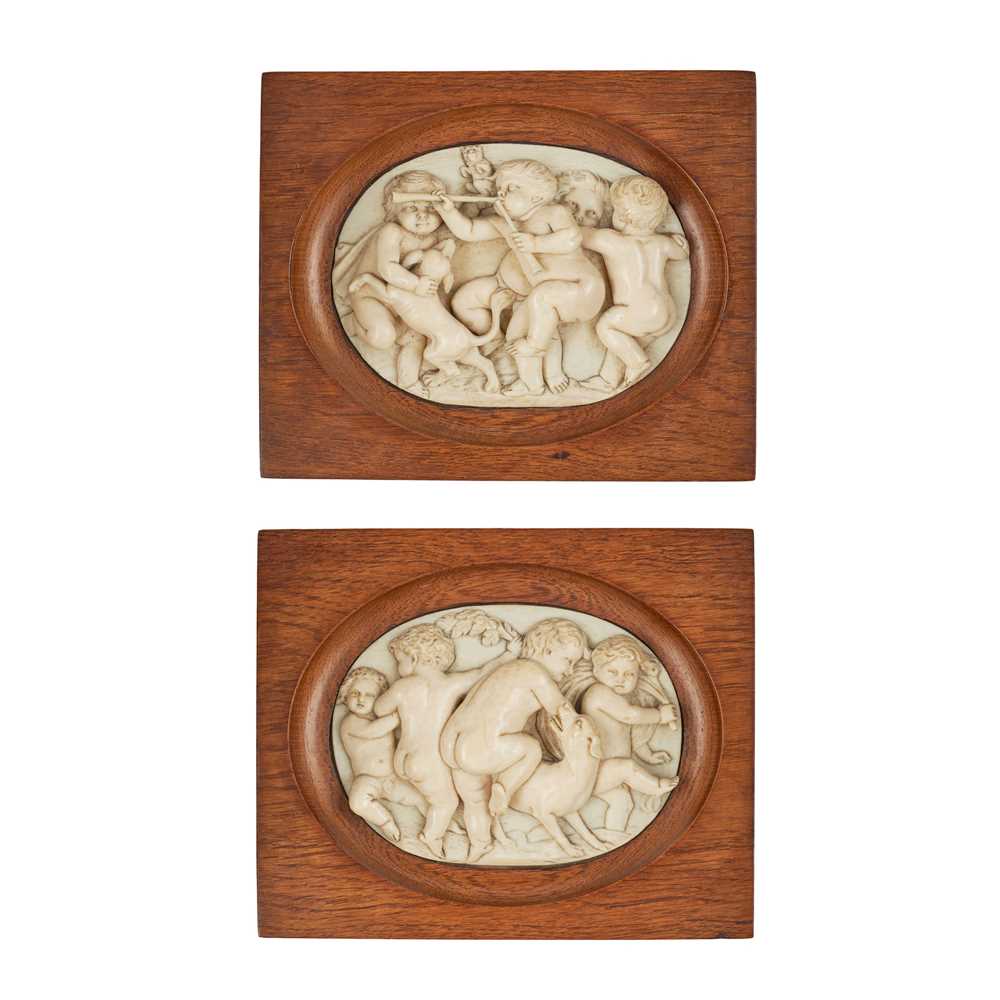 Appraisal: Y PAIR OF CONTINENTAL CARVED IVORY PLAQUES TH CENTURY oval