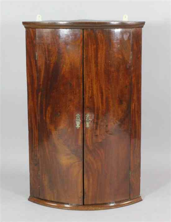 Appraisal: A George III mahogany bow front hanging corner cabinet ft