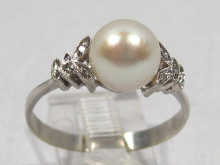 Appraisal: A white metal tests carat gold pearl and diamond ring