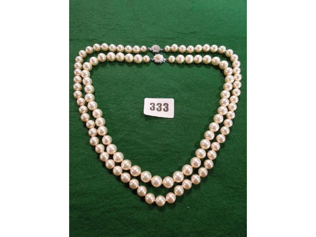 Appraisal: Two pearl necklaces each with silver clasps