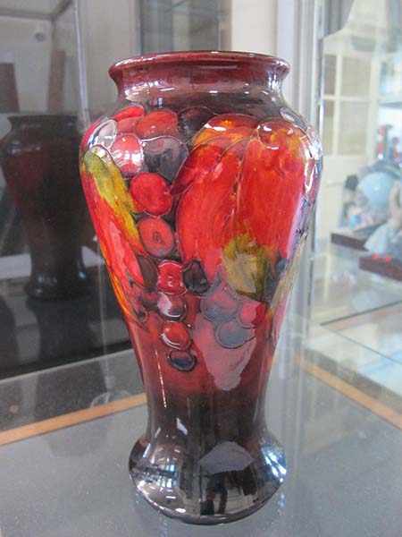 Appraisal: WILLIAM MOORCROFT BERRIES AND LEAVES FLAMBE VASE