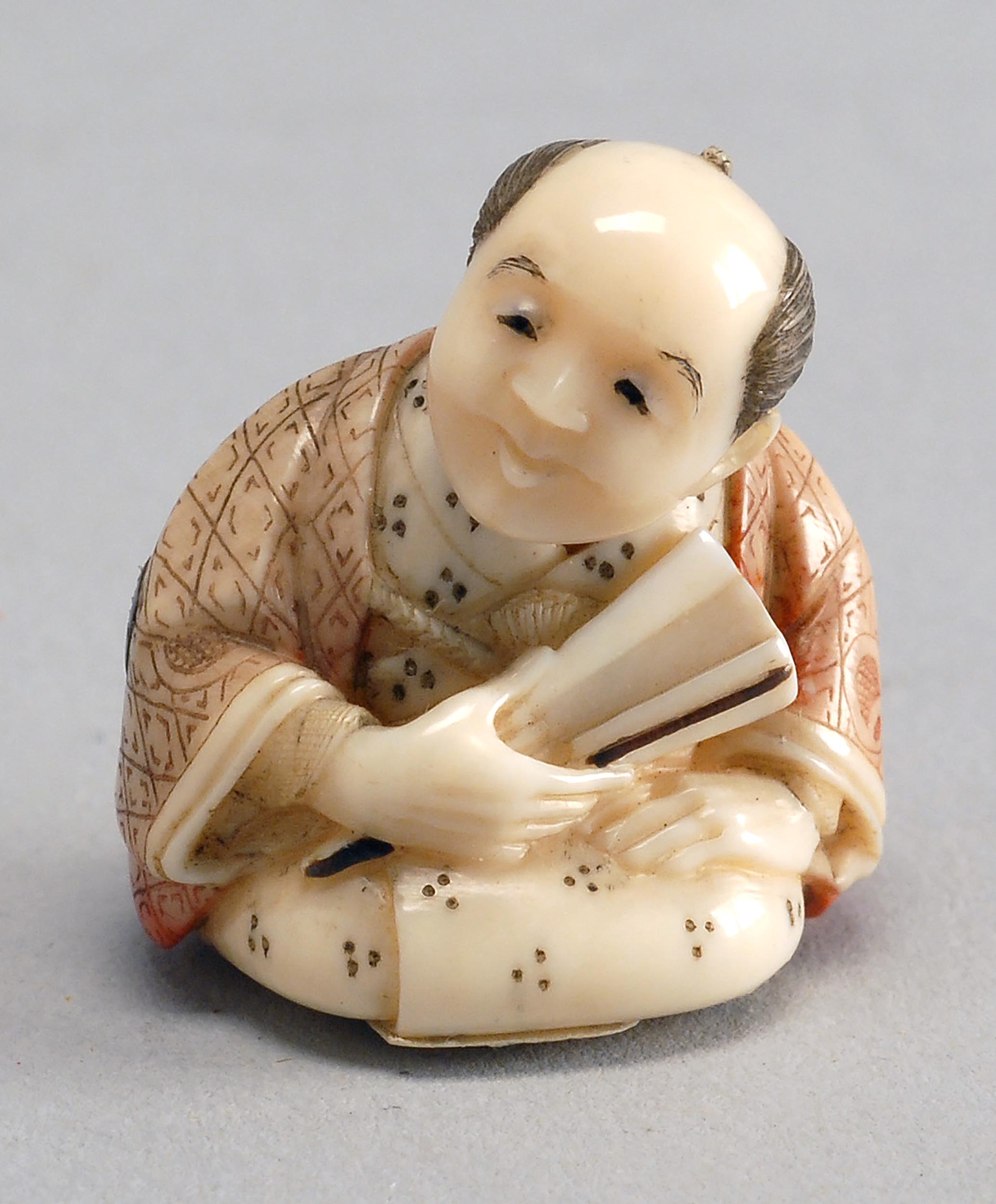 Appraisal: MINIATURE IVORY NETSUKE Early th CenturyDepicting a seated scholar with