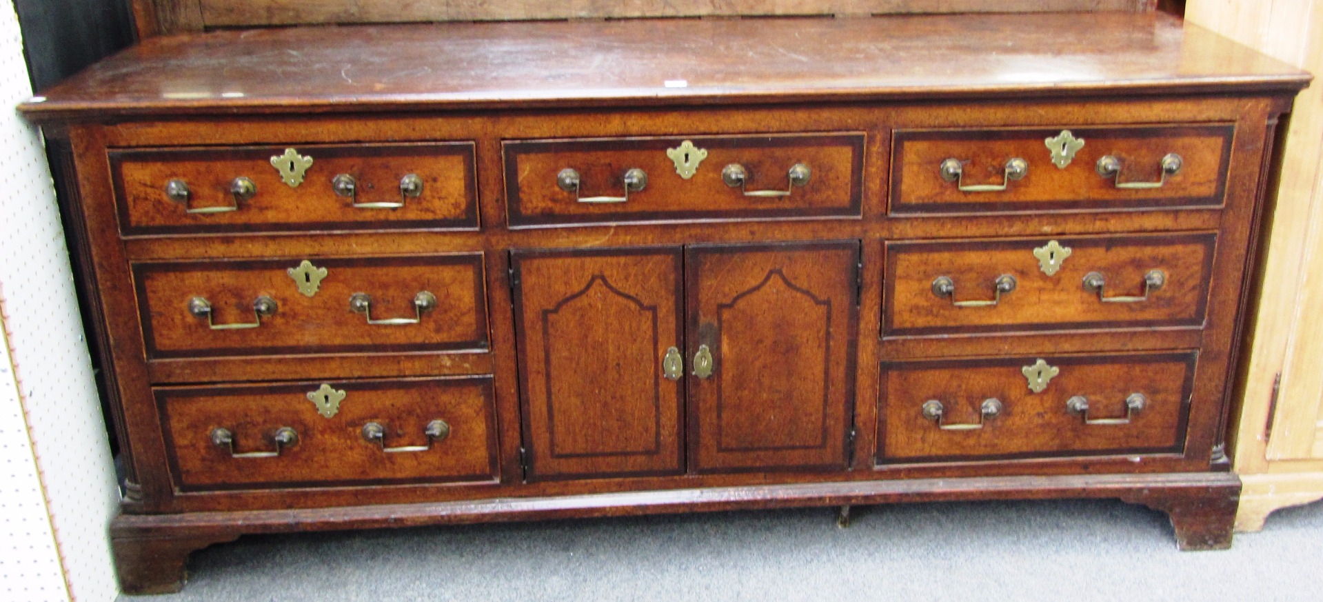 Appraisal: An th century oak and mahogany banded dresser base with