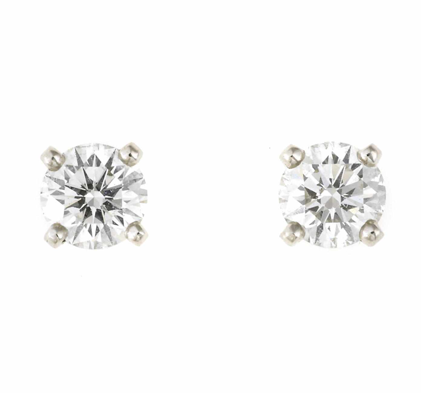 Appraisal: A pair of diamond solitaire earrings De Beers total round