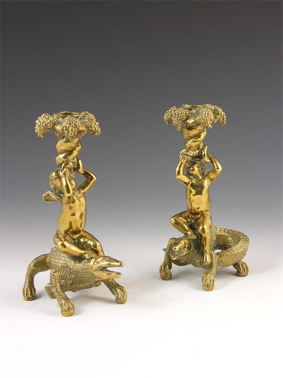 Appraisal: A pair of French brass candlesticks