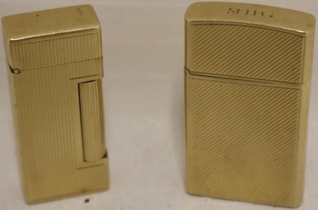 Appraisal: TWO KT GOLD LIGHTERS ONE IS DUNHILL U S PAT