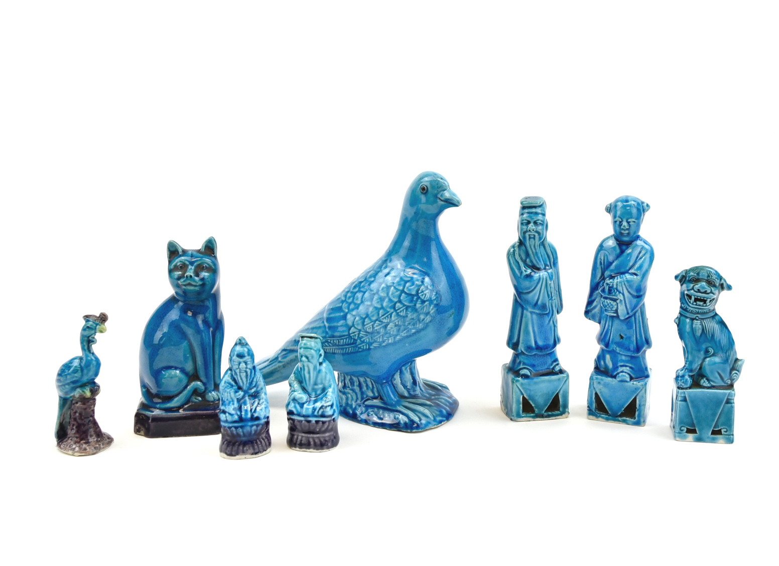 Appraisal: Chinese th C group of eight peacock blue glaze figures