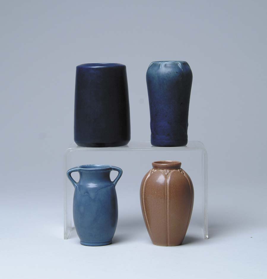 Appraisal: FOUR PIECES OF ROOKWOOD POTTERY Cylinder matte blue vase Marked