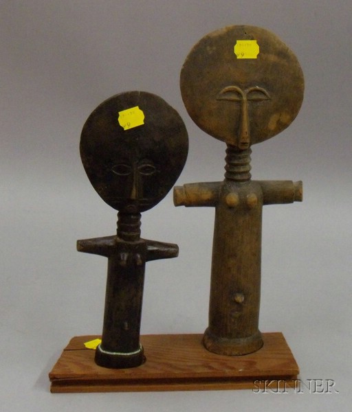 Appraisal: Two African Carved Wood Fertility Figures th century ht to