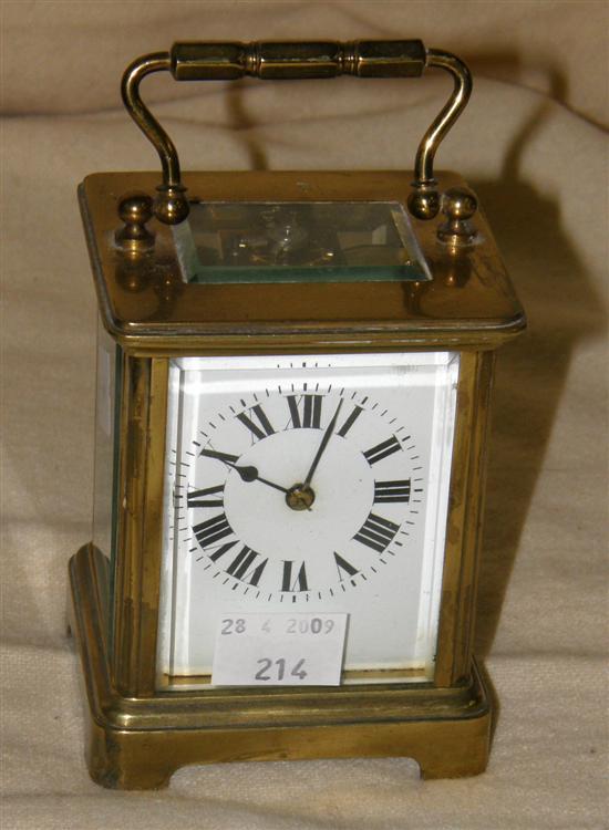 Appraisal: A BRASS MOUNTED CARRIAGE CLOCK with white enamel dial and