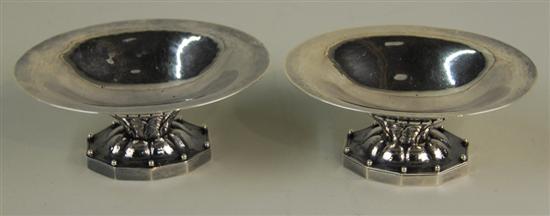 Appraisal: PAIR OF DANISH SILVER FOOTED NUT DISHES Georg Jensen length