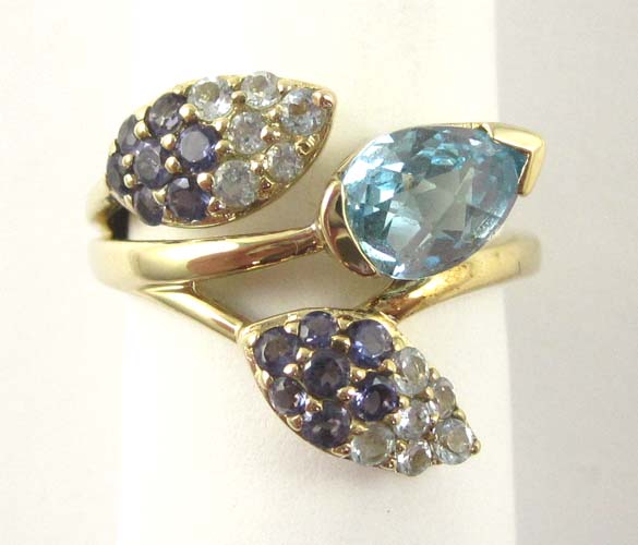 Appraisal: BLUE TOPAZ TANZANITE AND AQUAMARINE RING The k gold ring