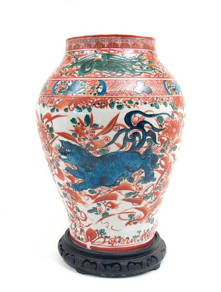 Appraisal: A Japanese porcelain vase depicting a lion height in