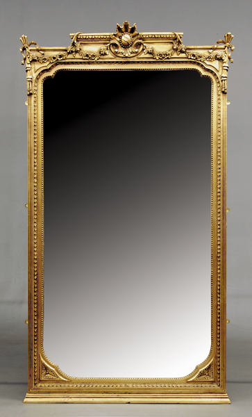 Appraisal: Continental carved giltwood pier mirror architecturally molded frame with floral