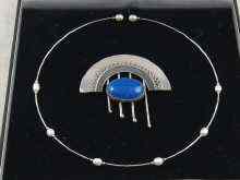 Appraisal: A white metal marked Art Deco style brooch together with