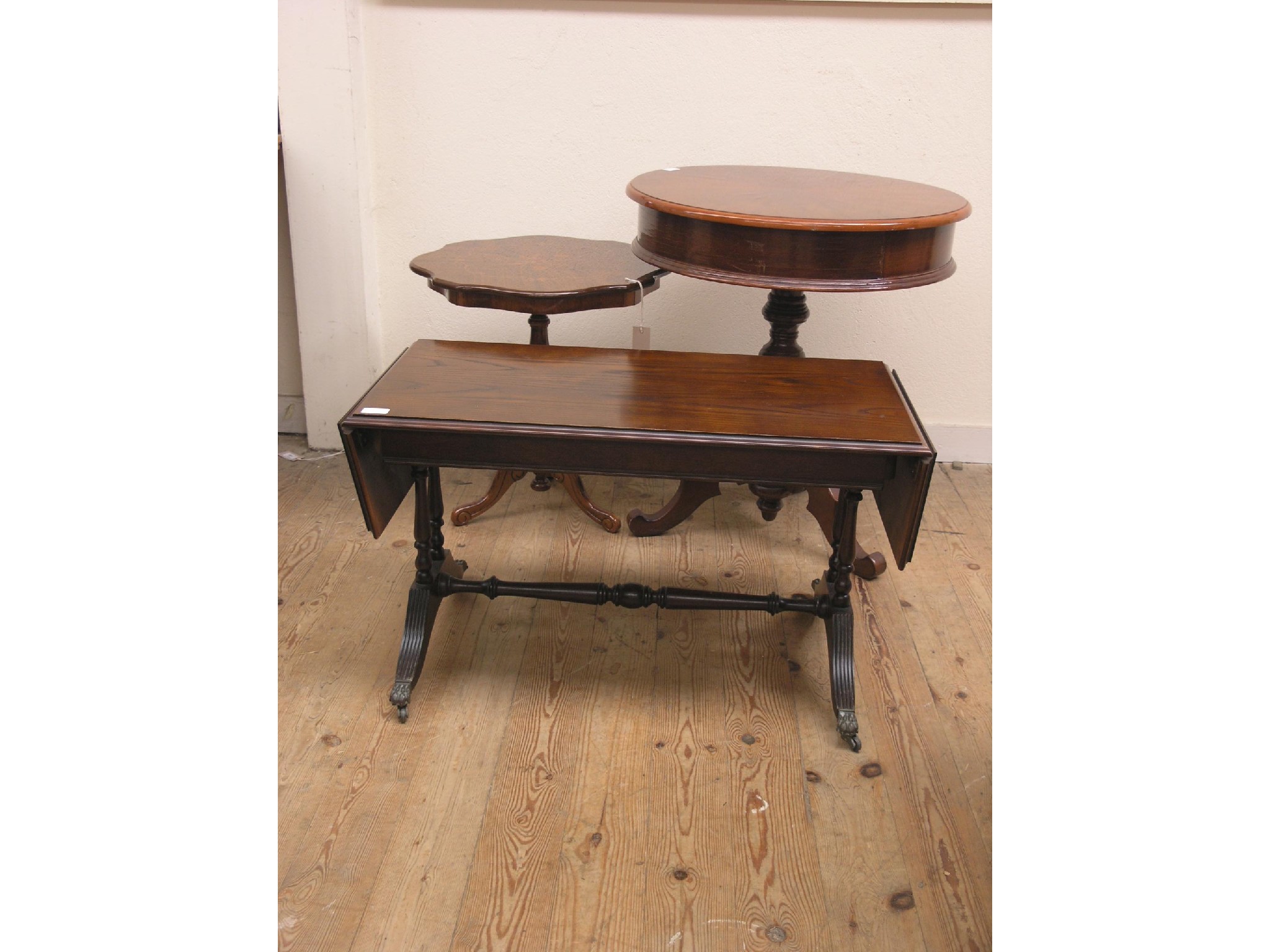 Appraisal: A circular mahogany drum table with single drawer ft in