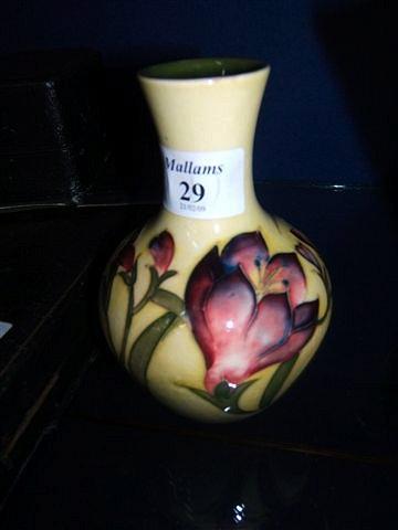 Appraisal: A yellow and green glazed Moorcroft vase high