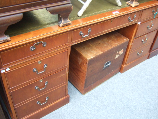 Appraisal: A th century yew wood partners desk the green leather