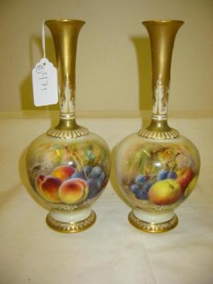 Appraisal: A PAIR OF ROYAL WORCESTER PORCELAIN VASES of bottle form