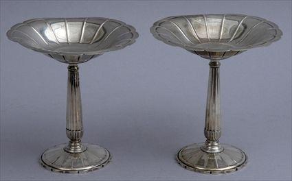 Appraisal: PAIR OF REED AND BARTON TROPHY COMPOTES Each fluted stem