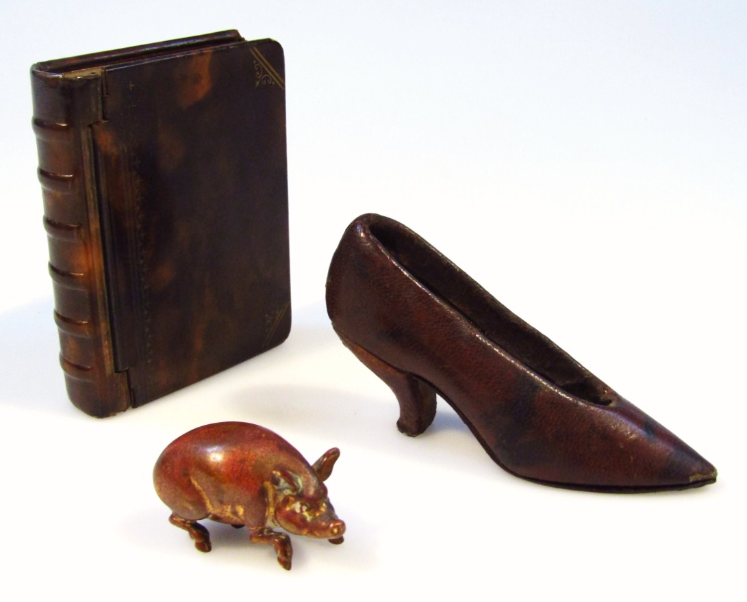 Appraisal: A metal cased and horn miniature book casket cm high