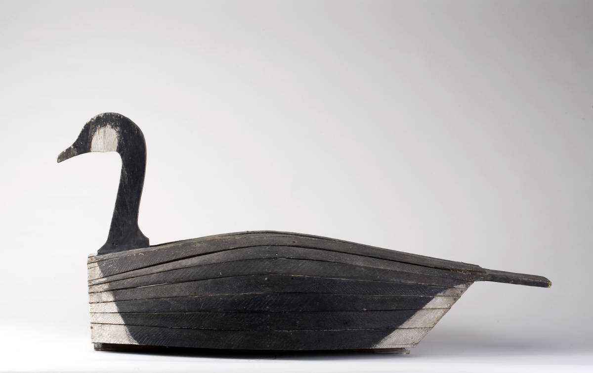 Appraisal: CARVED AND PAINTED SLAT GOOSE DECOY IN THE MANNER OF