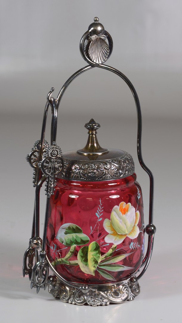 Appraisal: Enameled cranberry glass pickle castor mounted on a Middleton plate