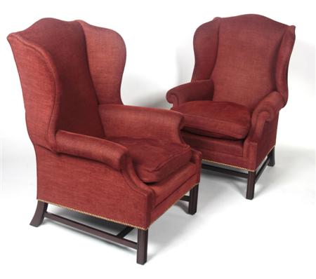 Appraisal: A pair of Chippendale style wingback armchairs the serpentine back