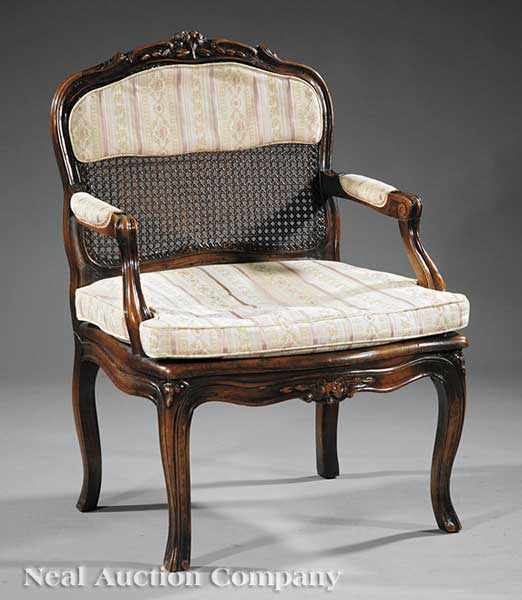 Appraisal: A Louis XV Carved Fruitwood Fauteuil th c arched floral