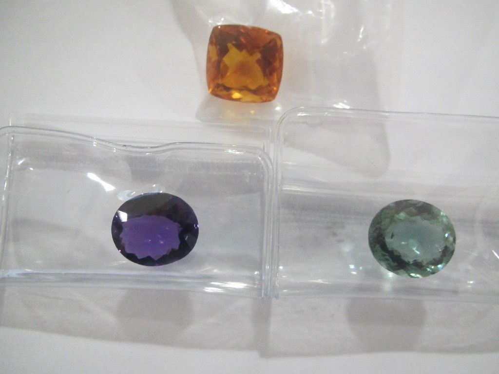 Appraisal: Three loose gem stones to include oval amethyst cts cushion