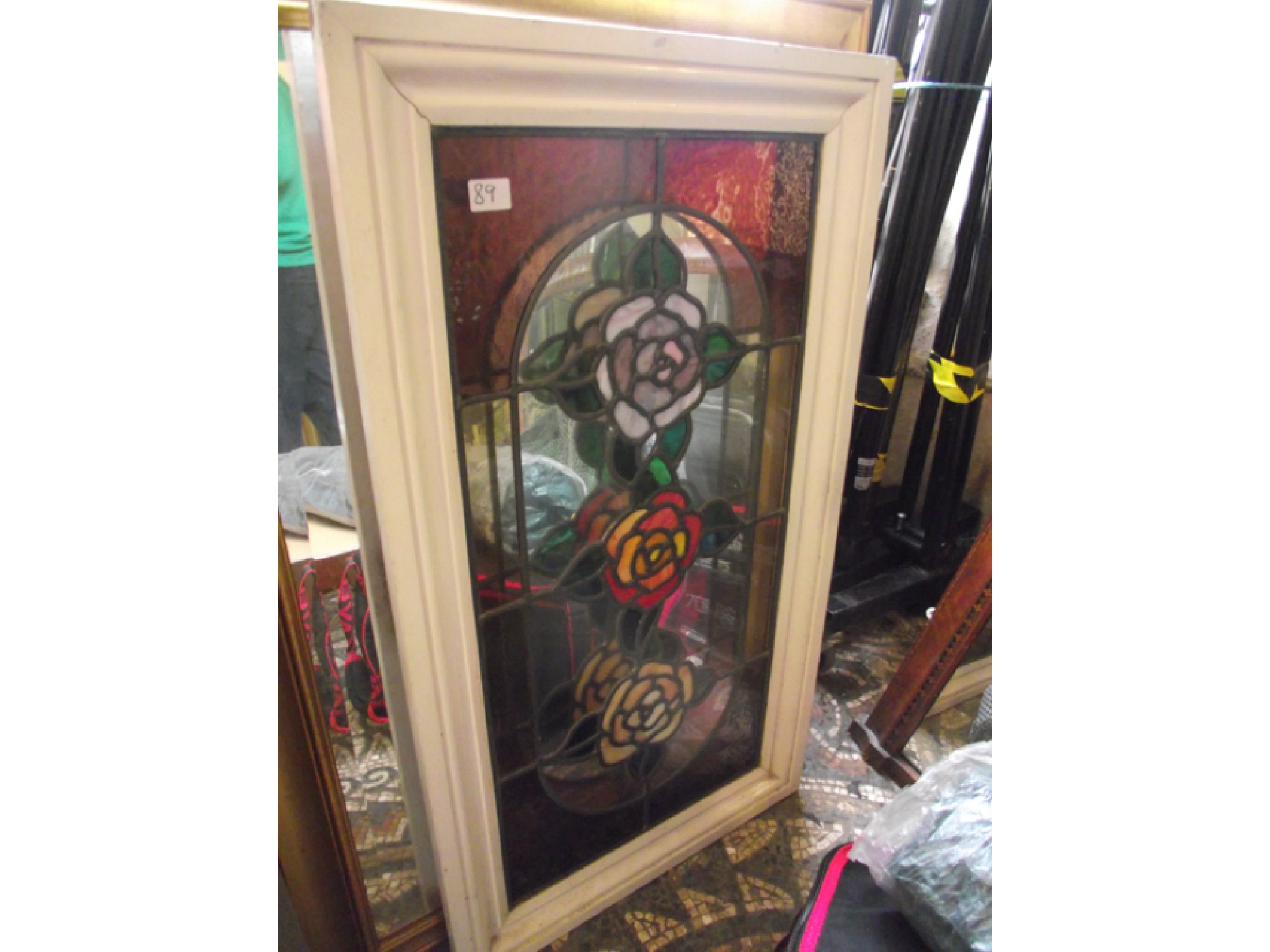 Appraisal: A contemporary stained glass panel of three colourful rose heads