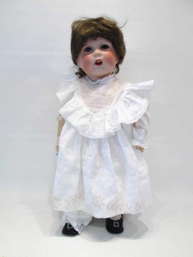 Appraisal: UNIS FRANCE BISQUE SOCKET HEAD DOLL having brown wig blue